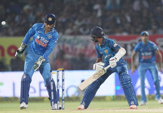 Sri Lanka’s Dasun Shanaka is bowled by India’s Ravindra Jadeja as Mahendra Singh Dhoni looks on