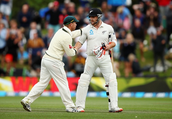 Brendon McCullum of New Zealand is congraulated by David Warner of Australia 