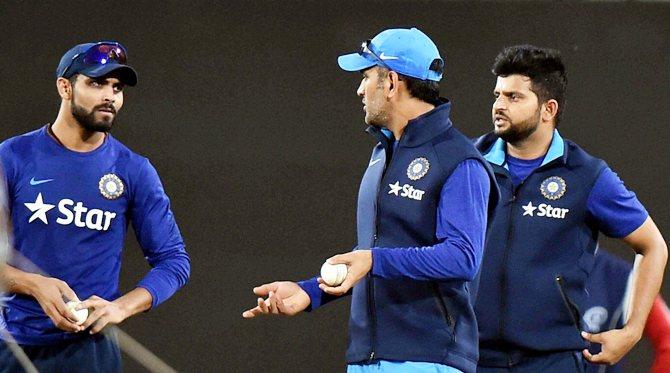 M S Dhoni, Ravindra Jadeja and Suresh Raina during a practice session