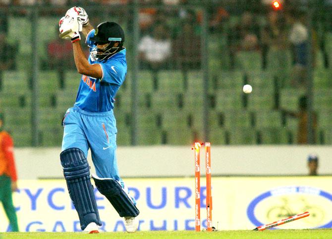 Shikhar Dhawan is bowled by Bangladesh's Al-Amin Hossain