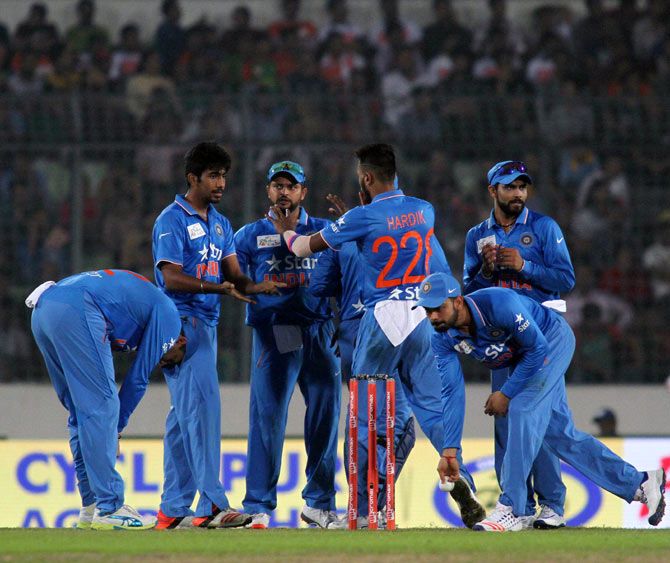 Indian players celebrate the wicket of Bangladesh's Soumya Sarkar during the first match of the Asia Cup Twenty20 tournament in Dhaka on Wednesday