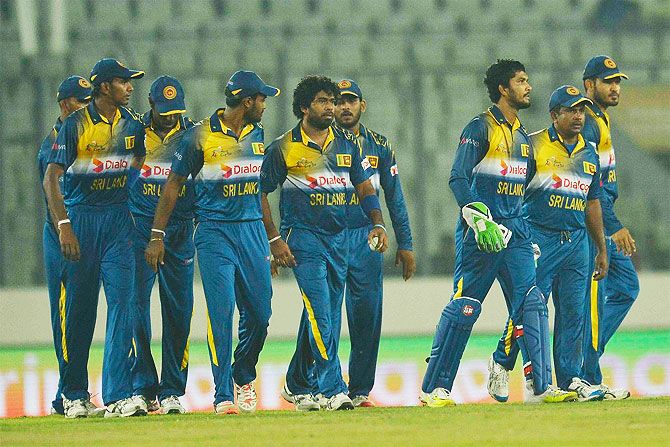 The Sri Lanka cricket walk off the field after beating UAE by 14 runs in the Asia Cup Twenty20 on Thursday