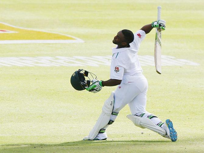 South Africa's Temba Bavuma celebrates scoring a century during the second cricket Test match against England in Cape Town on Tuesday