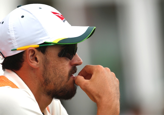 Mitchell Starc of Australia looks on during a match 