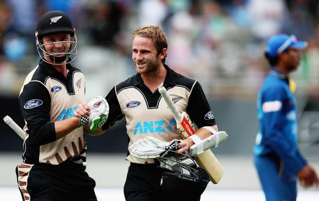 Colin Munro of New Zealand celebrates with captain Kane Williamson 