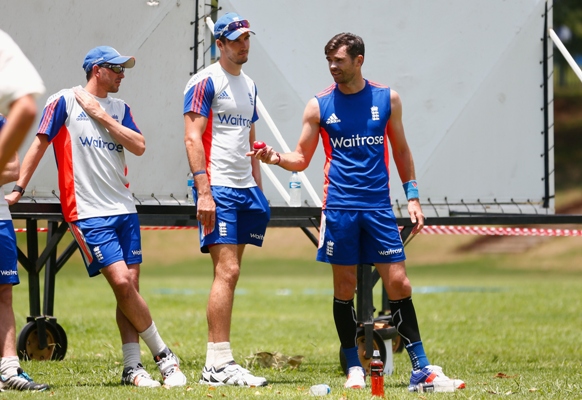 James Anderson, Steven Finn and Mark Footitt of England talk during a training session 