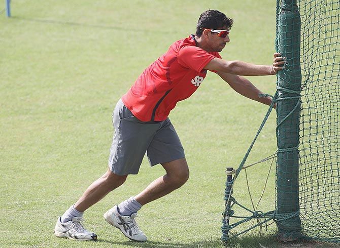 Ashish Nehra warms up during an India nets session