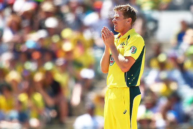 James Faulkner of Australia looks on