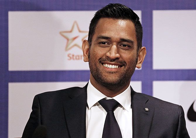 India's cricket captain Mahendra Singh Dhoni smiles during a news conference