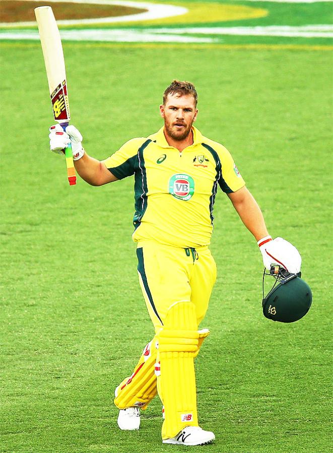 Australia opener Aaron Finch celebrates after scoring a century.