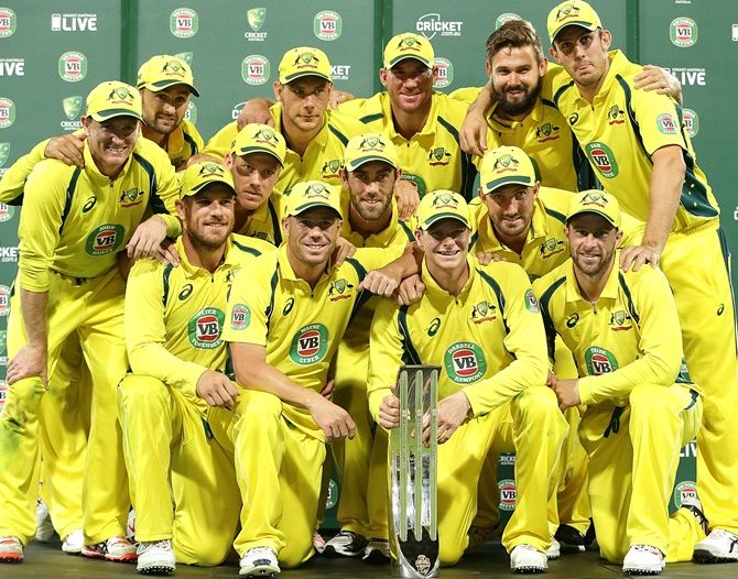 The Australian team pose with the winners trophy after winning the series
