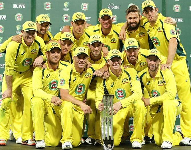 The Australian team pose with the winners trophy after winning the series