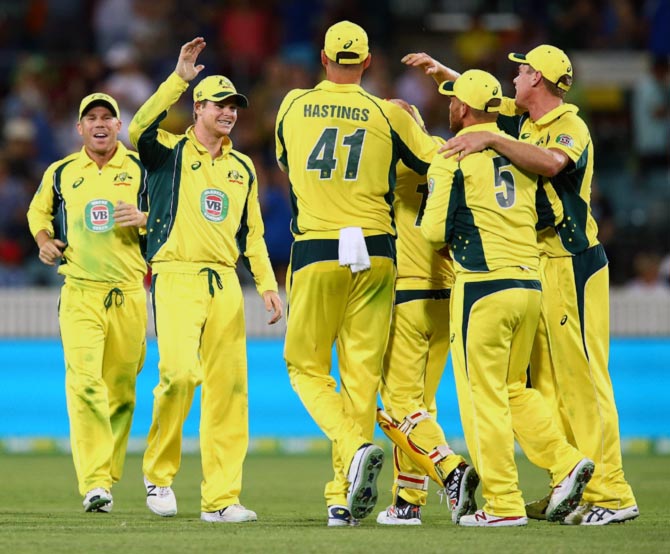 The Australian team celebrates winning 
