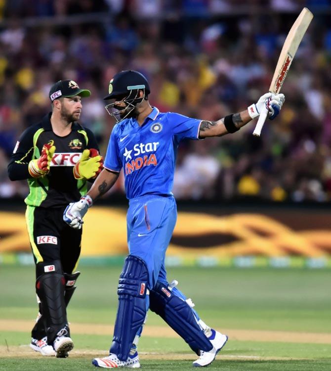 India's Virat Kohli reacts after reaching his half century during the first Twenty20 International match against Australia at Adelaide Oval on Tuesday