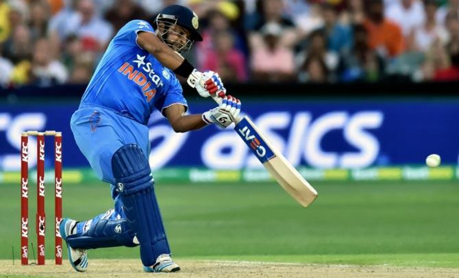 Suresh Raina hits a boundary through the off-side