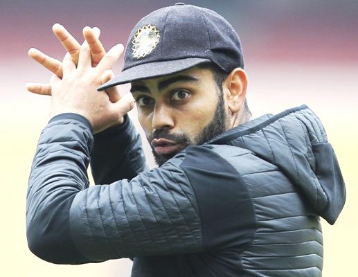 India's Virat Kohli attends a practice session 