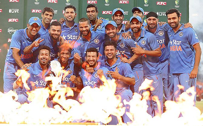 The Indian team celebrate with the series trophy after beating Australia to win the T20I series 3-0 at Sydney Cricket Ground on Sunday