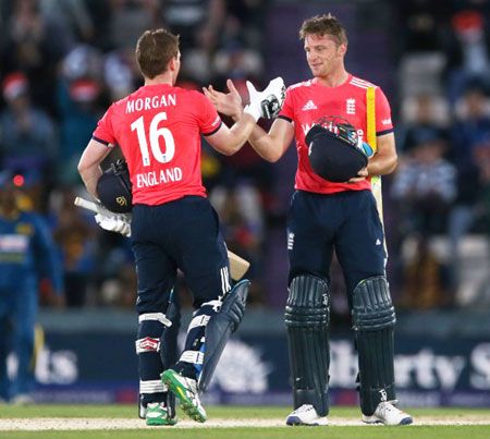 England’s Eoin Morgan (L) and Jos Buttler celebrate winning the T20 match against Sri Lanka on Tuesday
