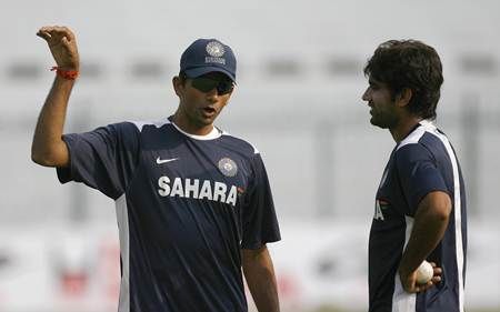 Venkatesh Prasad, left, gives tips to Munaf Patel during a training session when he was India's bowling coach