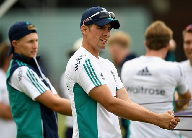 England captain Alastair Cook warms up alongside Joe Root