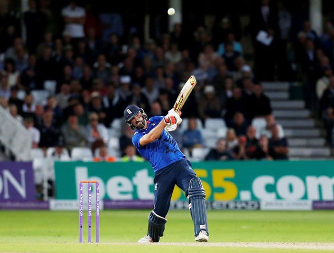 England's Liam Plunkett hits a six from the last ball to draw the match 
