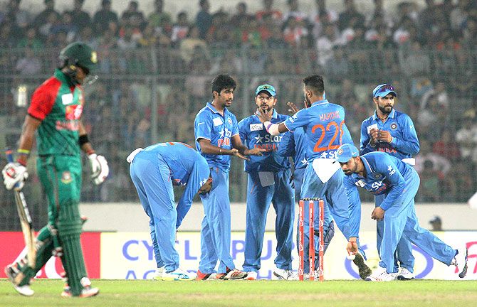India players celebrate the wicket of Bangladesh's Soumya Sarkar during their Asia Cup match on February 24