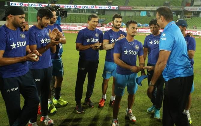 Pawan Negi receives the India cap from Team Director Ravi Shastri