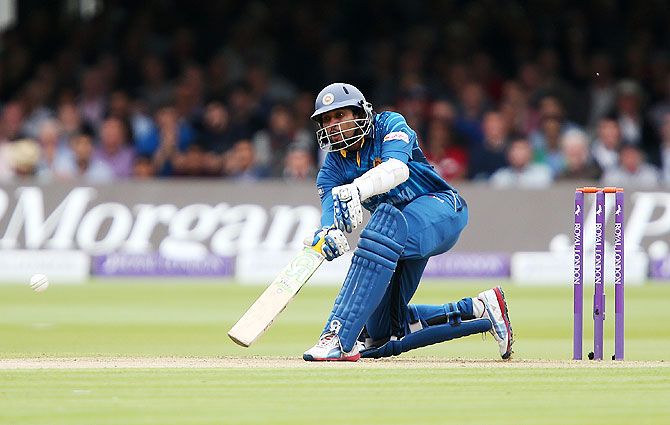 Sri Lanka's Tillakaratne Dilshan plays the 'Dilscoop' shot off the bowling of England's James Anderson during an ODI match at Lord's Cricket Ground in London