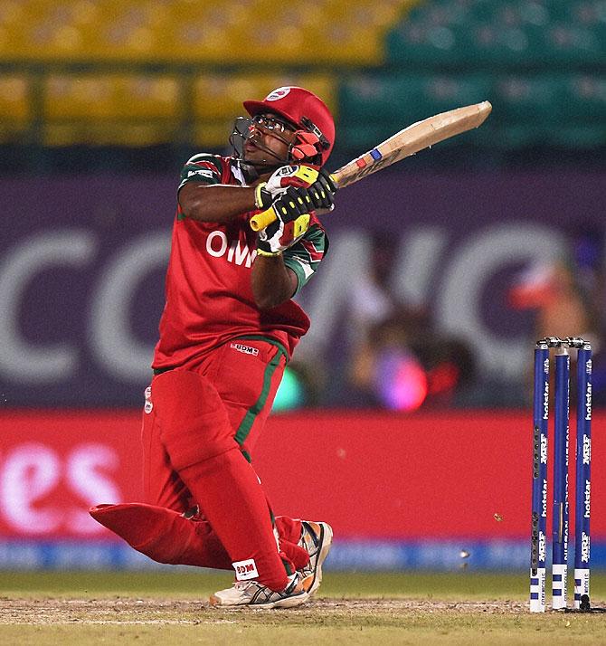 Oman batsman Aamer Ali plays a shot against Ireland during their ICC T20 World cup qualifier match in Dharamsala on Wednesday