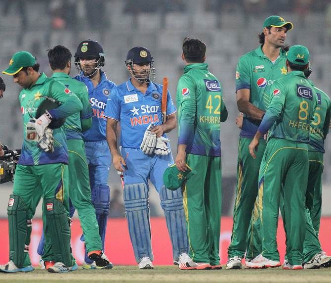 Pakistan's players congratulate India skipper Mahendra Singh Dhoni after the Asia Cup match in Dhaka.