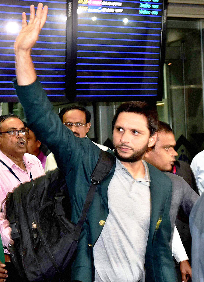 Pakistan captain Shahid Afridi waves to fans at the airport in Kolkata on Saturday
