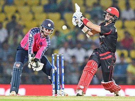 Hong Kong batsman Mark Chapman plays a shot during the ICC T20 World cup match against Scotland in Nagpur on Saturday