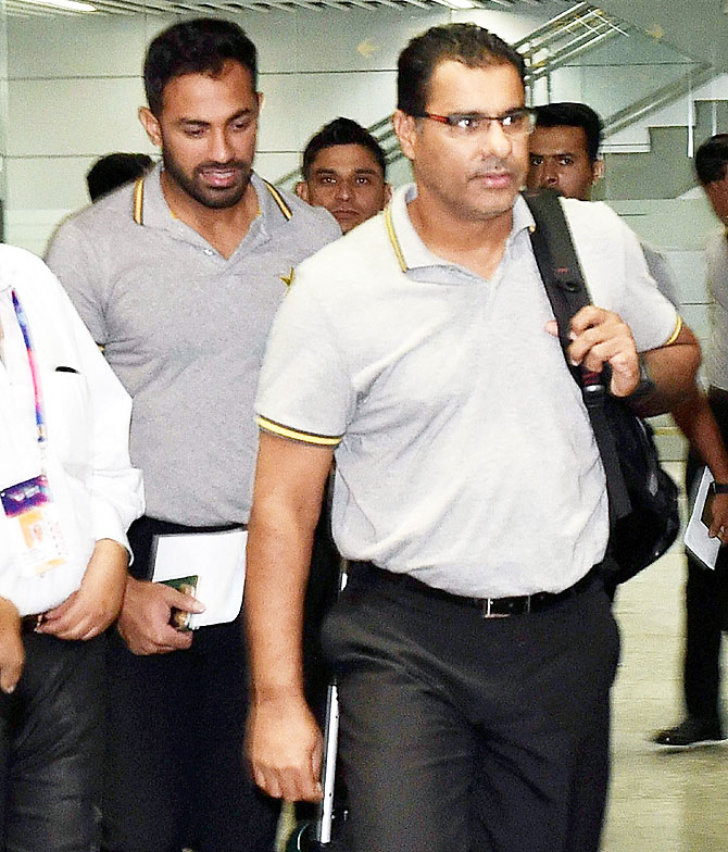 Pakistan coach Waqar Younis and left-arm paceman Wahab Riaz (left) arrive in Kolkata on Saturday