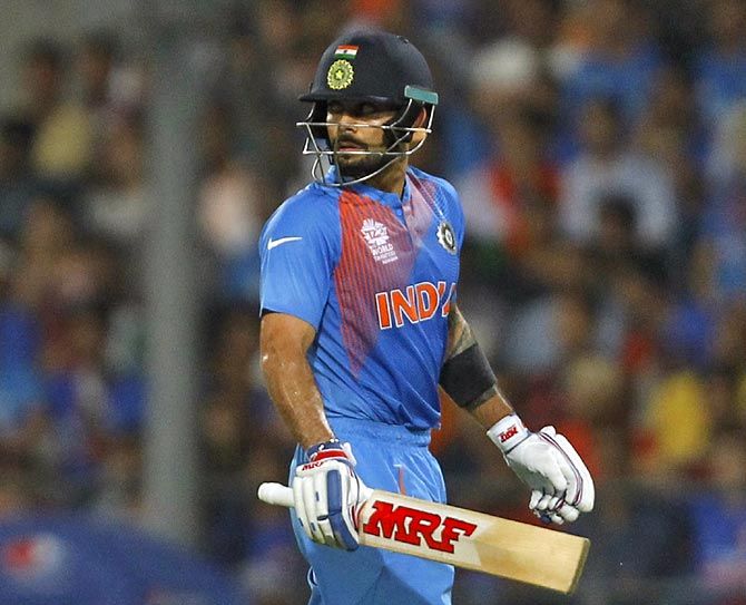 Virat Kohli walks back after his dismissal during the opening match of World T20 in Nagpur, on Tuesday