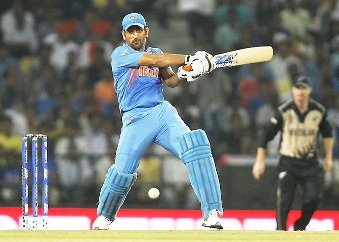India's captain Mahendra Singh Dhoni plays a shot during the opening match of the World T20 against New Zealand in Nagpur on Tuesday