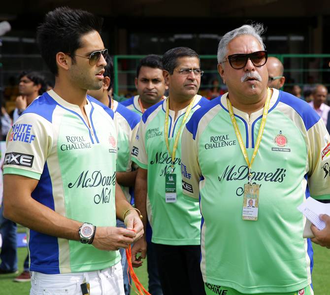 Vijay Mallya, right, with his son Siddhartha at an IPL match in 2013