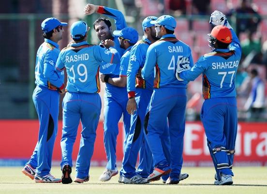 Mohammad Nabi celebrates with teammates after dismissing England Captain Eoin Morgan during a World Twenty20 game in Delhi. Photograph: Gareth Copley/Getty Images