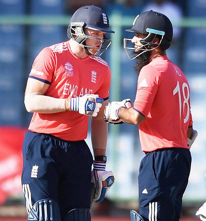 England's batsmen David Willey and Moeen Ali during the World Cup T20 mach against Afghanistan at Firozshah Kotla in New Delhi on Wednesday