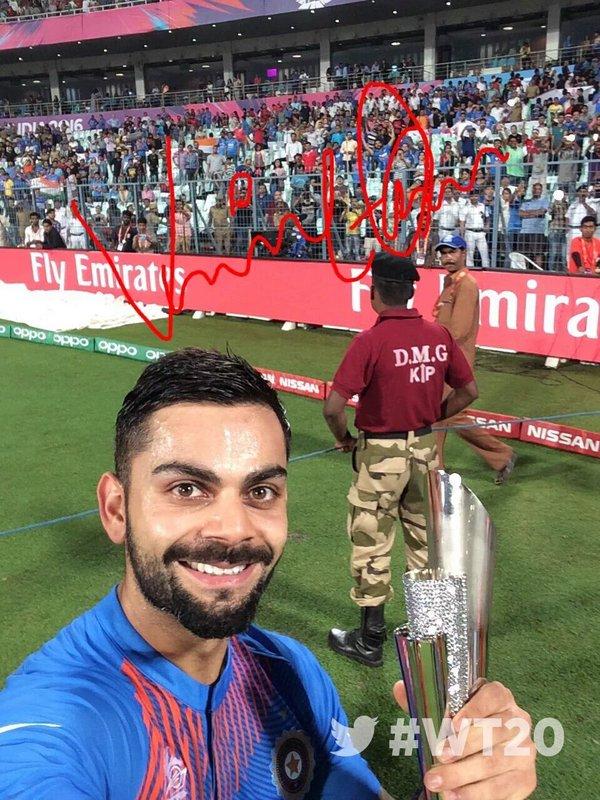 Virat Kohli with his man-of-the-match trophy against Pakistan at Kolkata. Photograph: BCCI