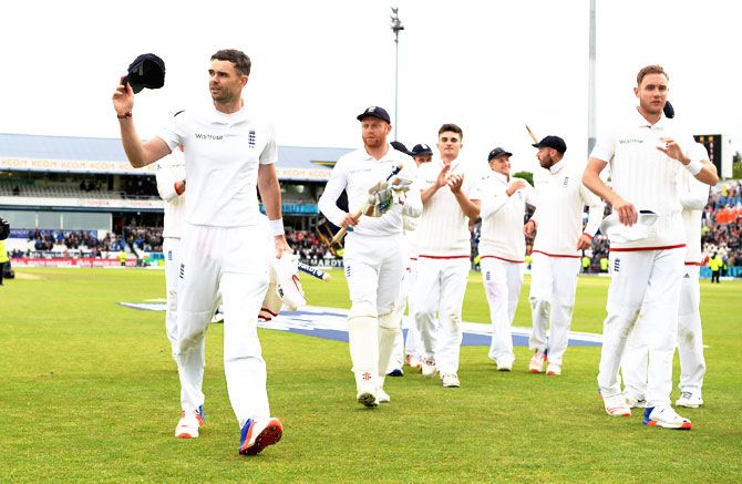 England'S James Anderson acknowledges the crowd as he leaves the field after taking a ten wicket haul to win the 1st Investec Test match