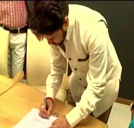 MP Anurag Thakur signs his nomination papers on Saturday