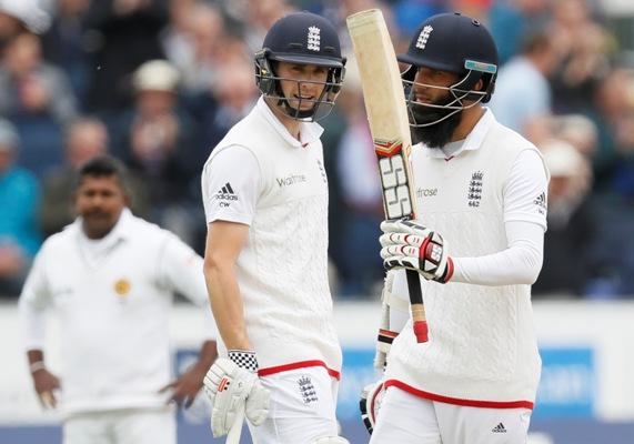 Chris Waokes and Moeen Ali