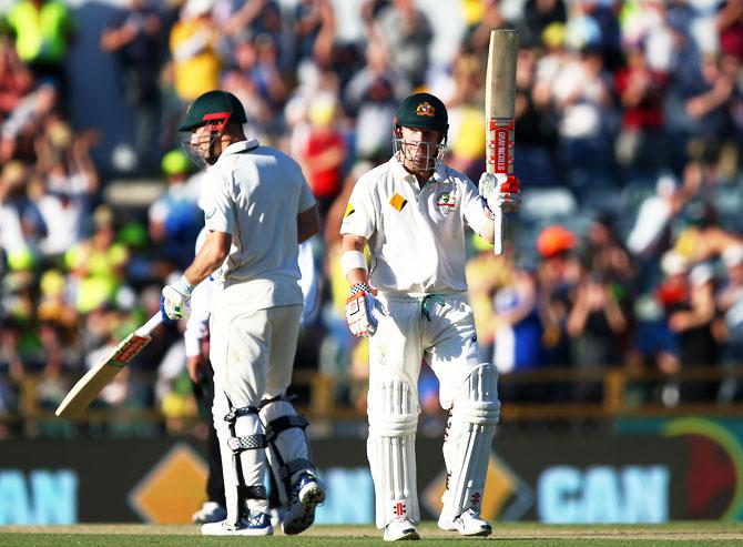 Australia's David Warner celebrates reaching his half century on Day 1 of the first Test against South Africa at the WACA in Perth on Wednesday