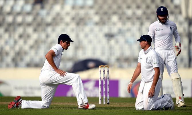England captain Alastair Cook, left, with team mates Joe Root, centre and Jonny Bairstow