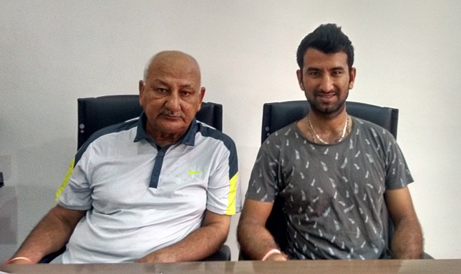 Arvind and Cheteshwar Pujara. Photograph: Haresh Pandya