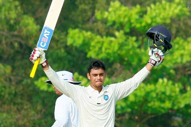 Jharkhand's Ishan Kishan celebrates his century against Delhi on Saturday