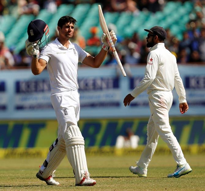 Alastair Cook, left, celebrates his century on Sunday