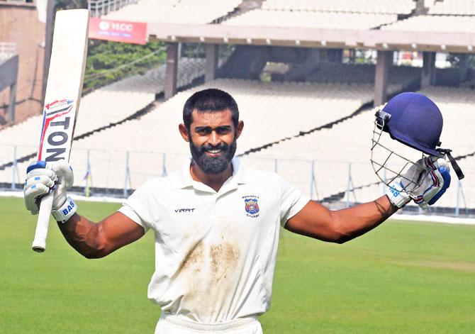 Maharashtra batsman Ankit Bawne celebrates his century against Vidarbha during their Ranji Trophy match at Eden Gardens in Kolkata on Monday