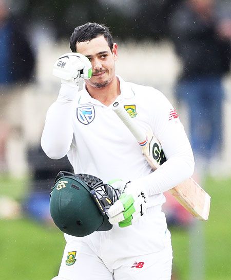 South Africa's wicketkeeper-batsman Quinton De Kock celebrates on completing a century against Australia in the 2nd Test in Hobart on Monday