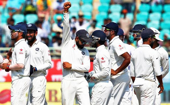 India's Virat Kohli celebrates with teammates after winning the 2nd Test match against England at Visakhapatnam on Monday